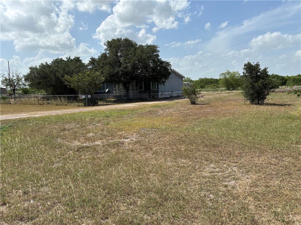 568 Jennifer Loop Orange Grove, TX 78372 - Photo 2 of 35 a view of a yard with a house