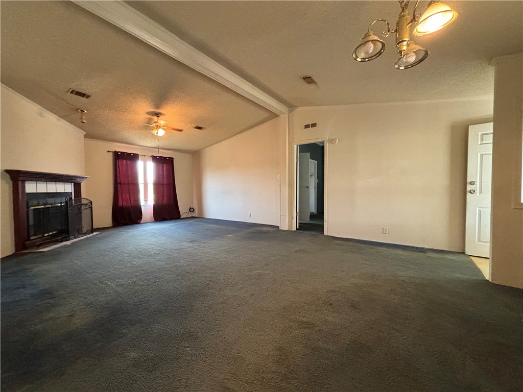 568 Jennifer Loop Orange Grove, TX 78372 - Photo 23 of 35 a view of empty room with fireplace and fan