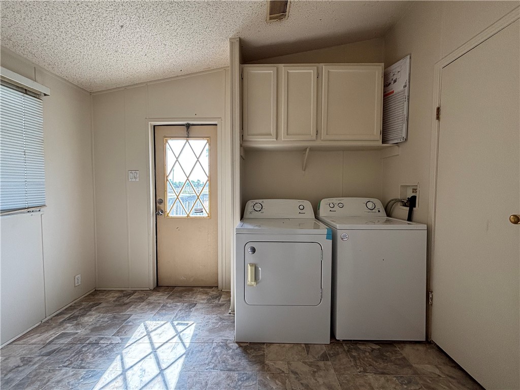 568 Jennifer Loop Orange Grove, TX 78372 - Photo 29 of 35 a view of storage and utility room with washer and dryer