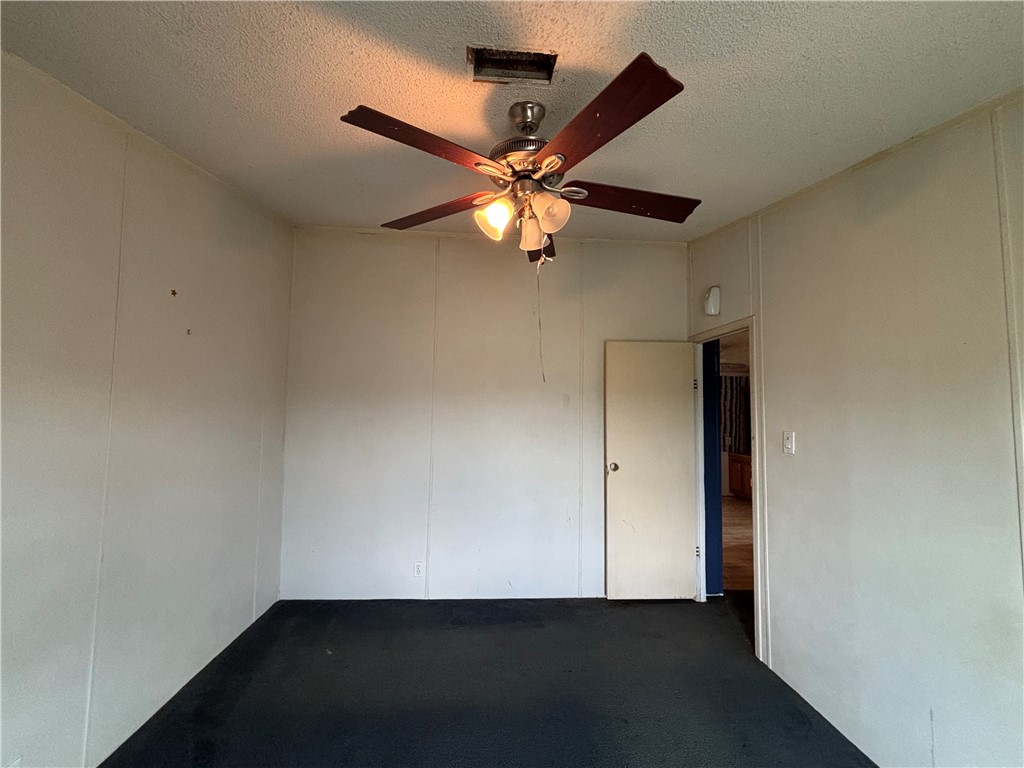 568 Jennifer Loop Orange Grove, TX 78372 - Photo 30 of 35 an empty room with a fan and a fan