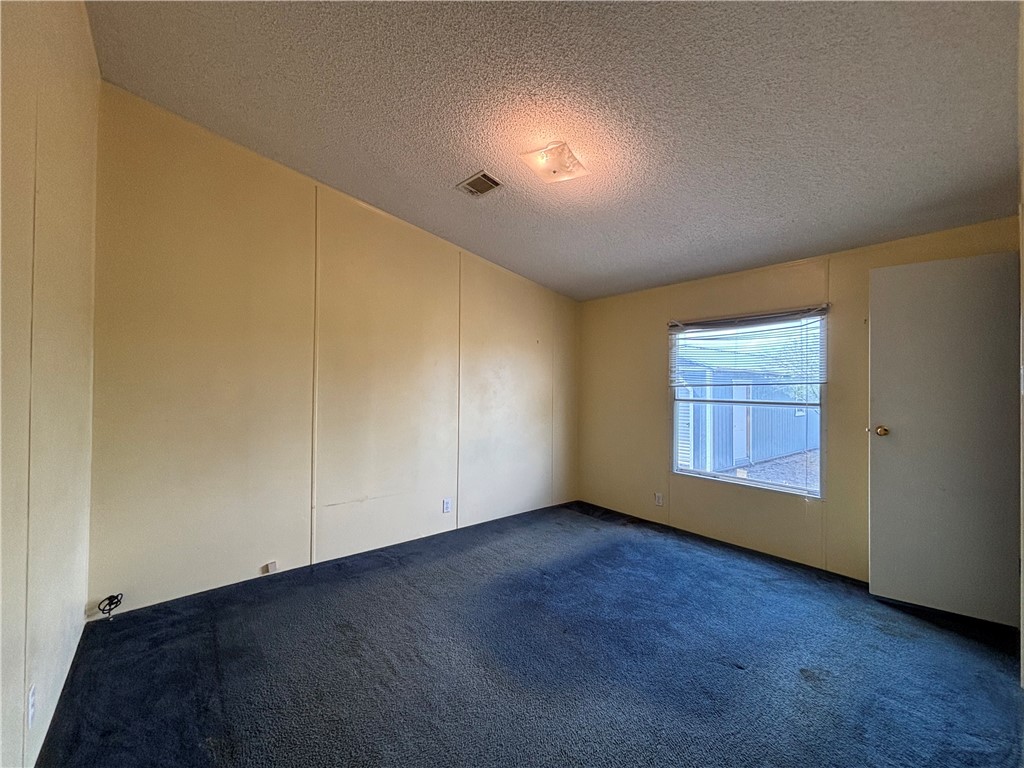568 Jennifer Loop Orange Grove, TX 78372 - Photo 32 of 35 a view of an empty room with a window