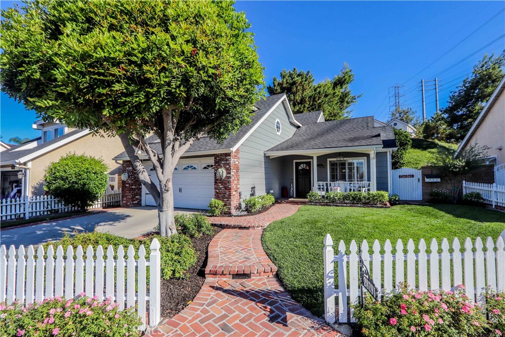 Darling home with large front yard and white picket fence!