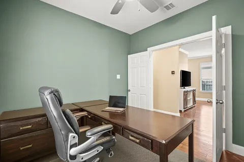 a view of a workspace with furniture