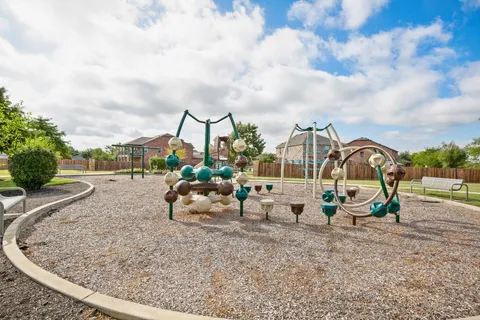 a view of yard with swimming pool and green space