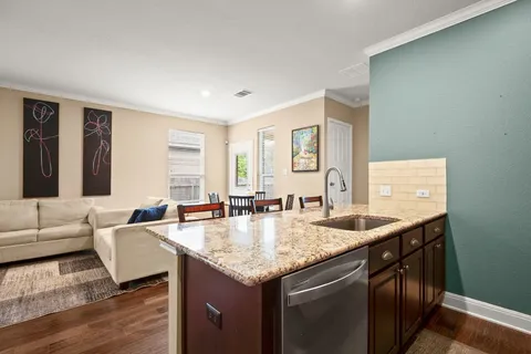 a living room with granite countertop furniture and a couch