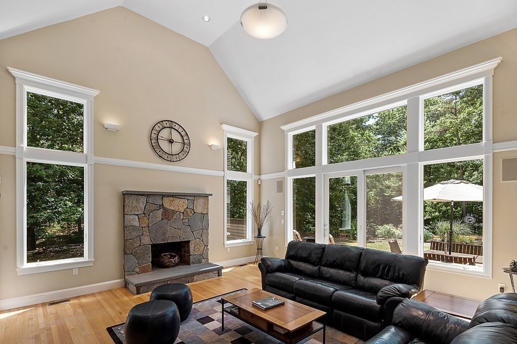 166 Tower Road Lincoln, MA 01773 - Photo 11 of 39 a living room with furniture and a fireplace