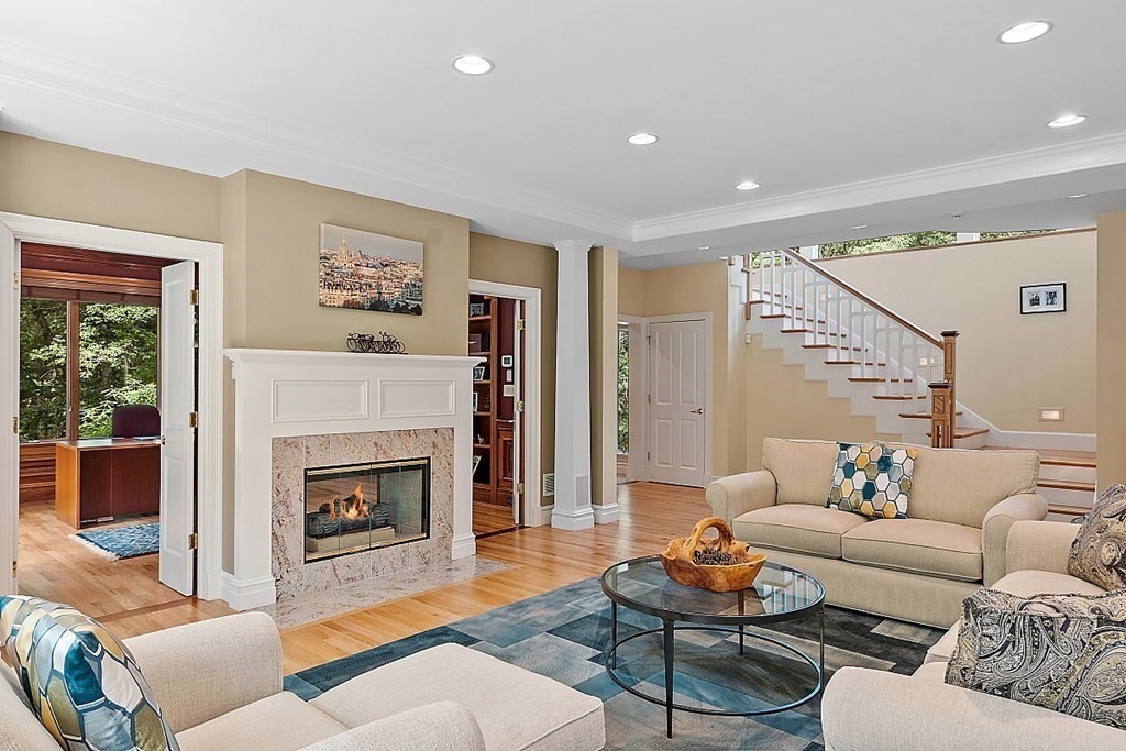 166 Tower Road Lincoln, MA 01773 - Photo 15 of 39 a living room with furniture and a fireplace