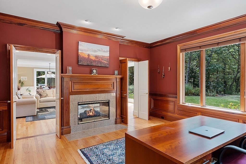 166 Tower Road Lincoln, MA 01773 - Photo 17 of 39 a living room with furniture and a fireplace