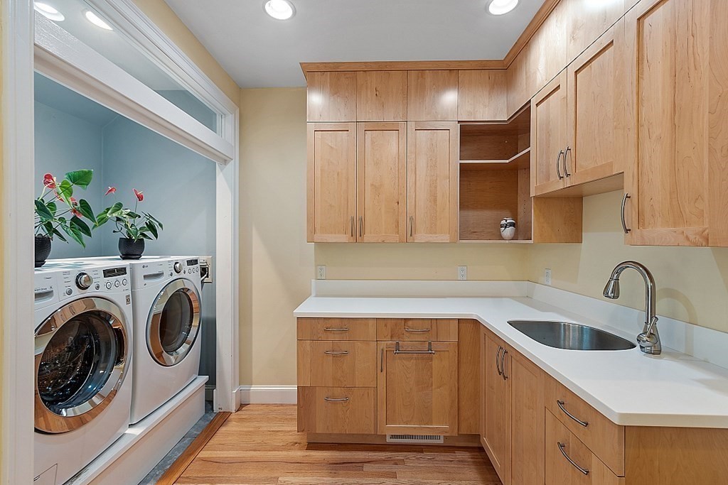 166 Tower Road Lincoln, MA 01773 - Photo 19 of 39 a kitchen with cabinets and a sink