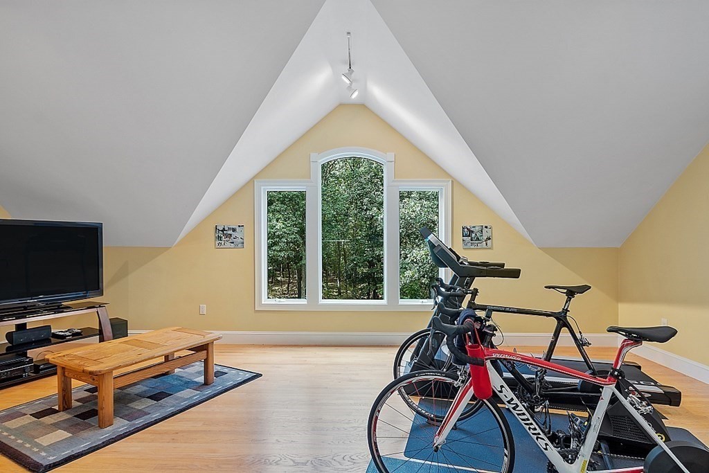 166 Tower Road Lincoln, MA 01773 - Photo 20 of 39 a view of a room with gym equipment