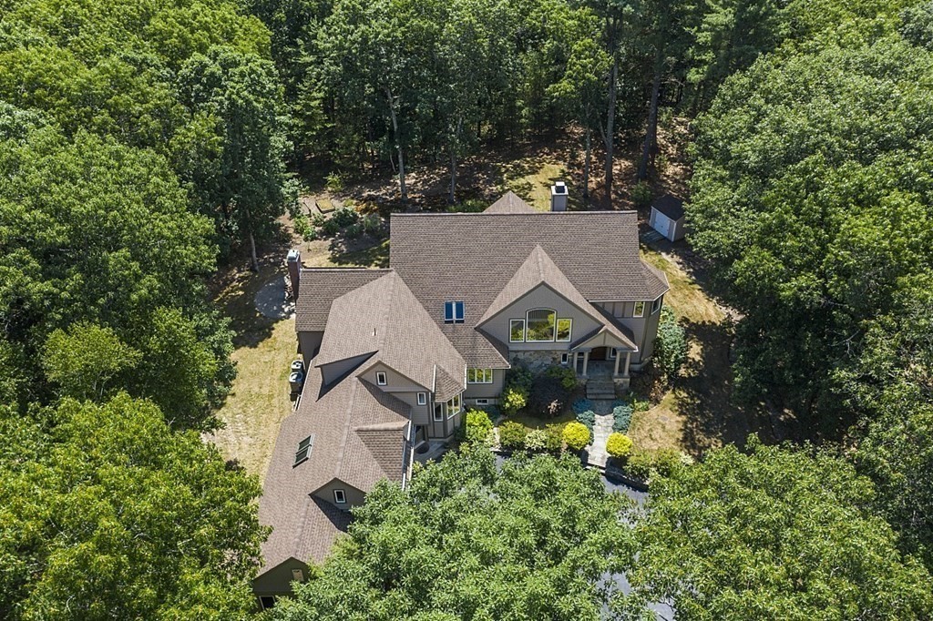 166 Tower Road Lincoln, MA 01773 - Photo 2 of 39 an aerial view of a house with a yard and large trees