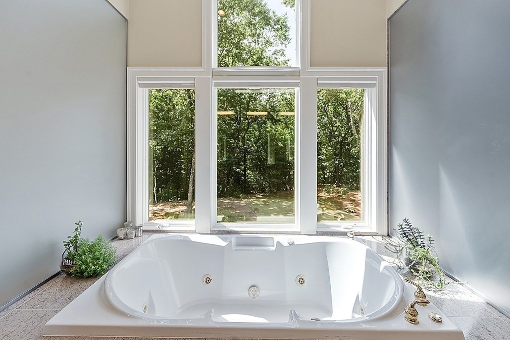 166 Tower Road Lincoln, MA 01773 - Photo 24 of 39 a bathroom with bathtub and window