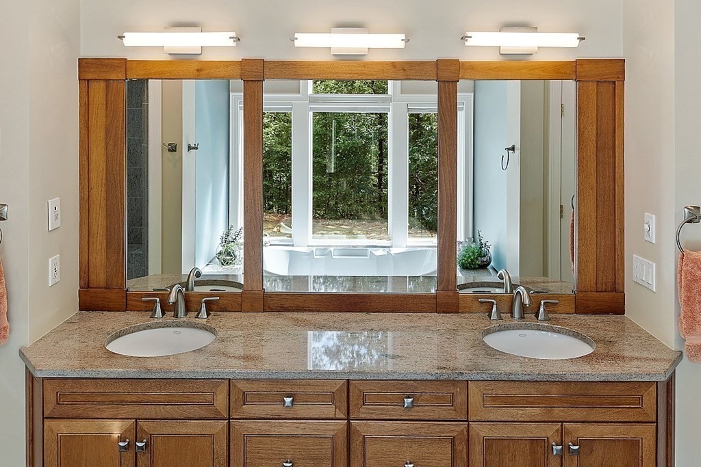 166 Tower Road Lincoln, MA 01773 - Photo 26 of 39 a bathroom with sink granite and a mirror