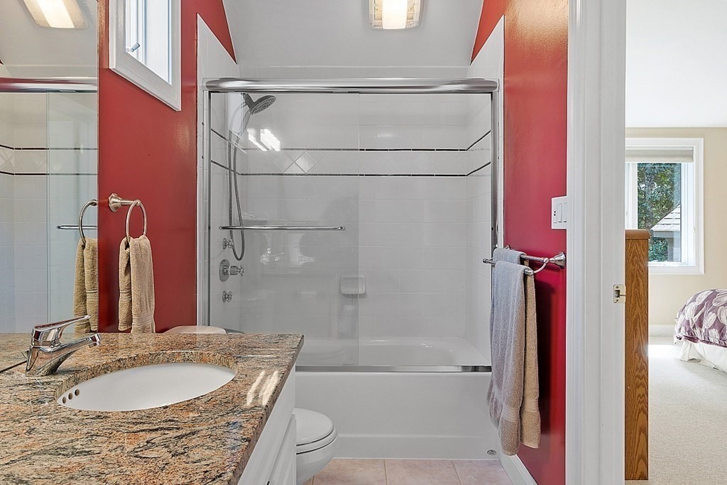 166 Tower Road Lincoln, MA 01773 - Photo 28 of 39 a bathroom with a granite countertop bathtub shower sink vanity and toilet