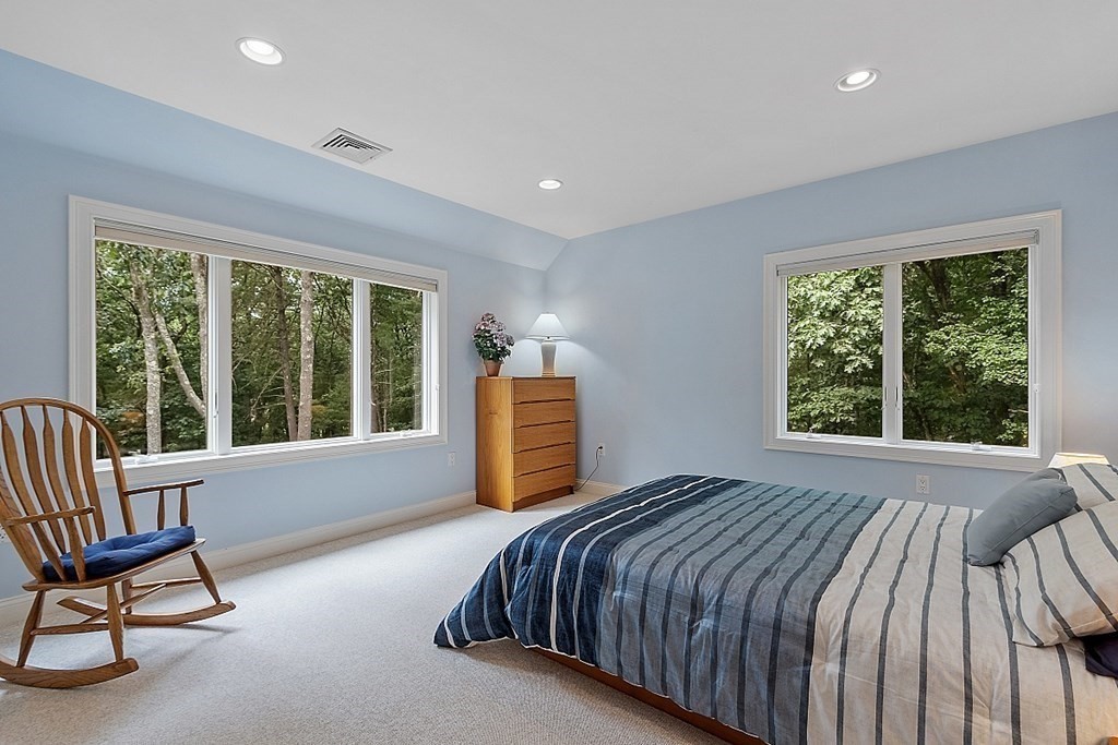166 Tower Road Lincoln, MA 01773 - Photo 29 of 39 a bedroom with a bed chair and window