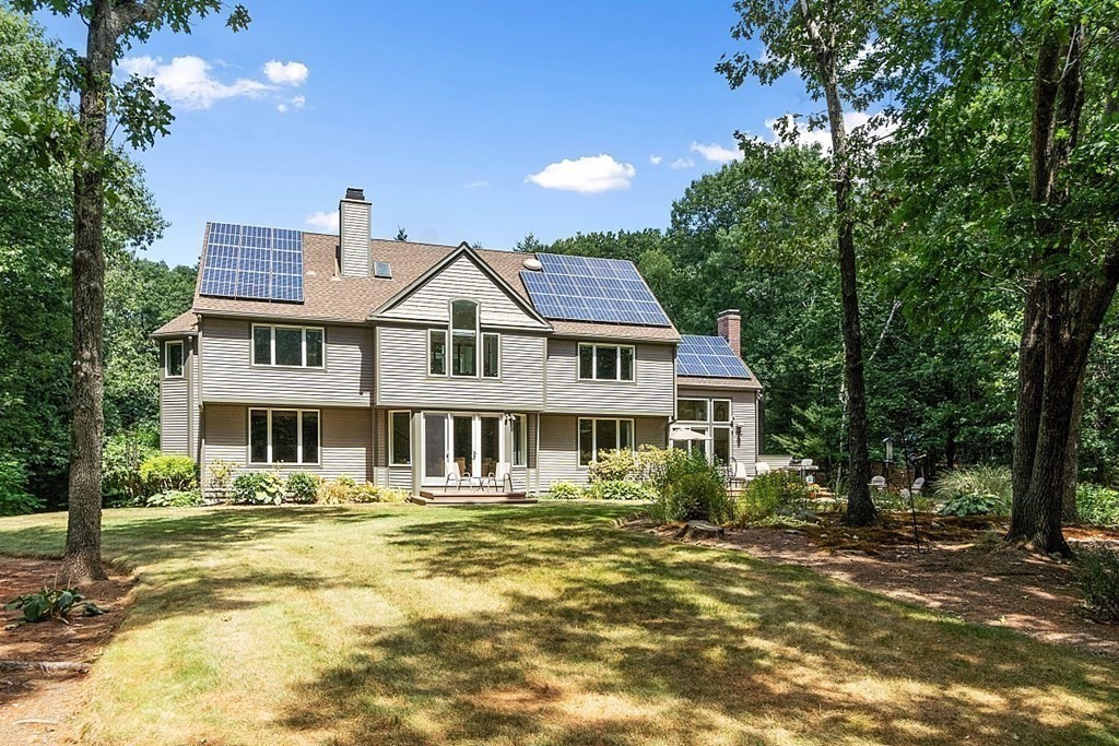 166 Tower Road Lincoln, MA 01773 - Photo 37 of 39 a front view of a house with a yard