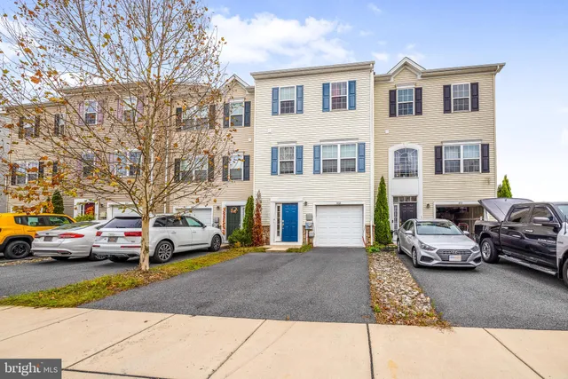 a view of a cars parked in front of a house