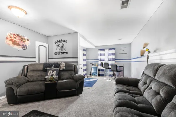 a living room with furniture and a couch