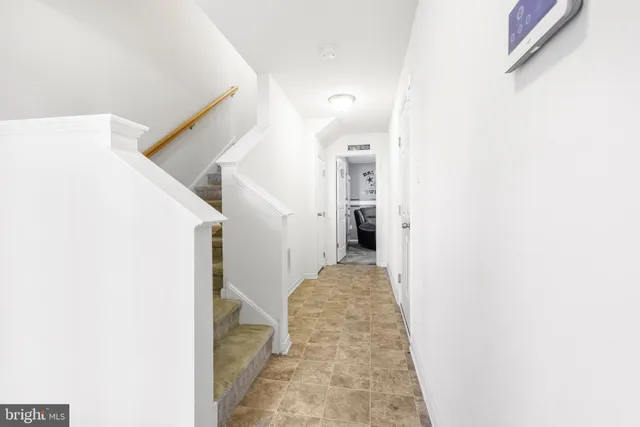 a view of a hallway with a white walls