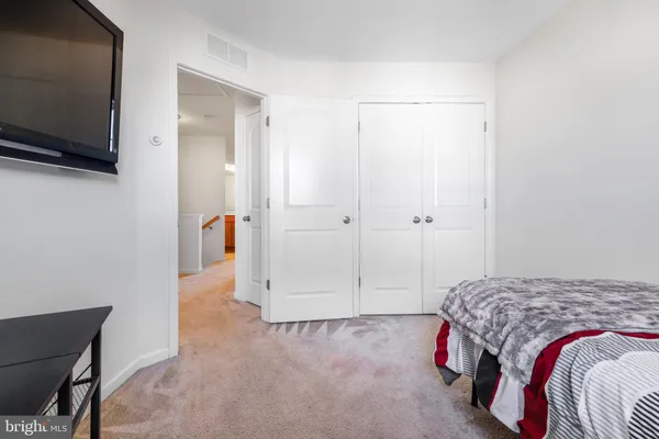 a view of bedroom with baby crib