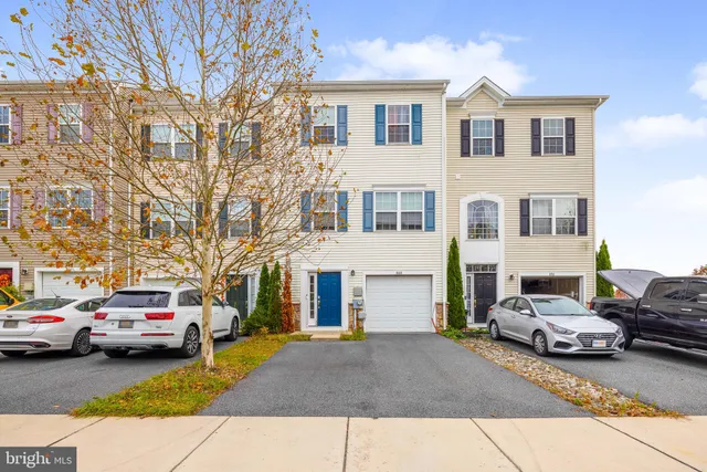 a view of a cars park in front of house