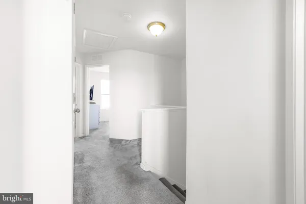 a view of a cars park in front of a house