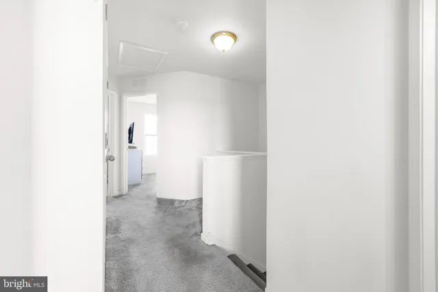 a view of a cars park in front of a house