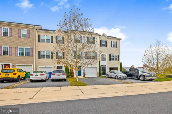 a view of a cars park in front of house