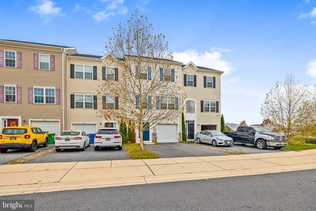a view of a cars park in front of house