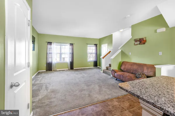 a view of livingroom with furniture and windows