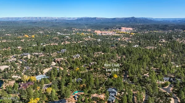an aerial view of residential house and green space