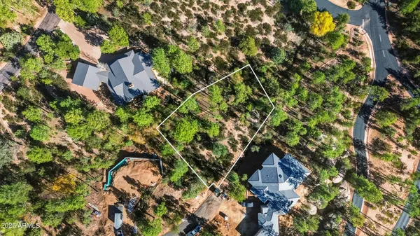 a aerial view of a house with a tree