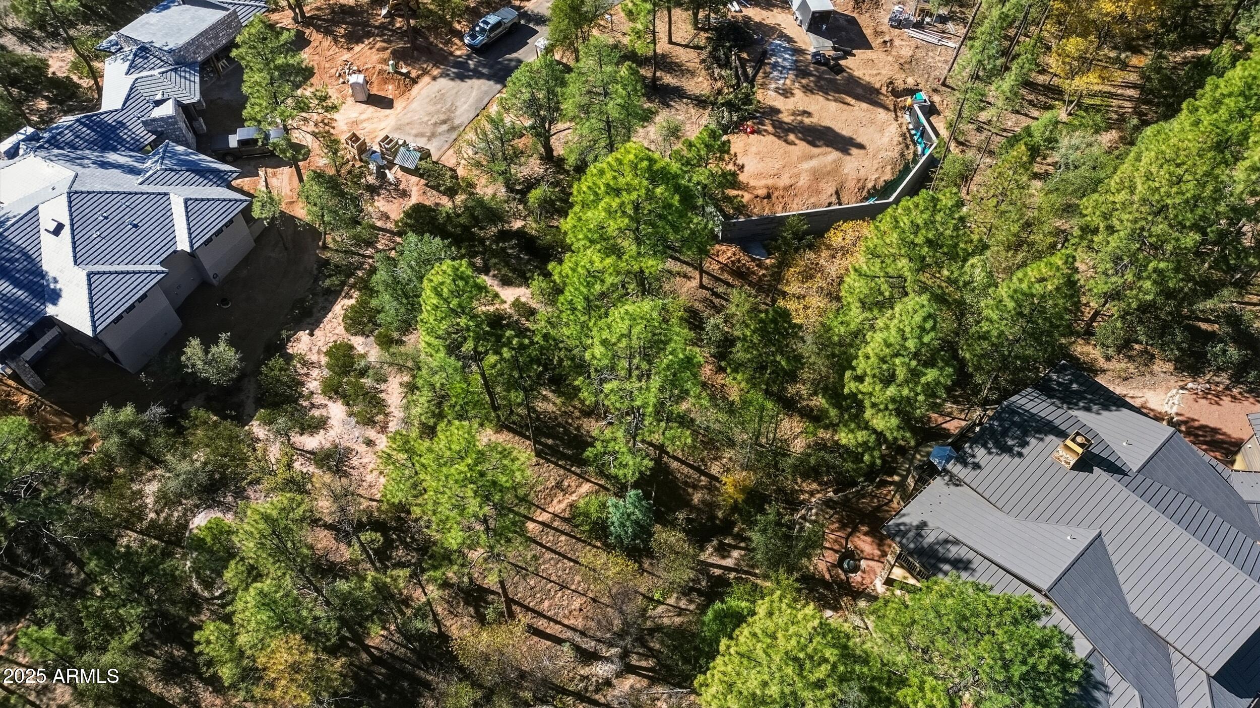 3004 East Game Trail, Unit 243 Payson, AZ 85541 - Photo 4 of 17 an aerial view of residential house with outdoor space and trees all around