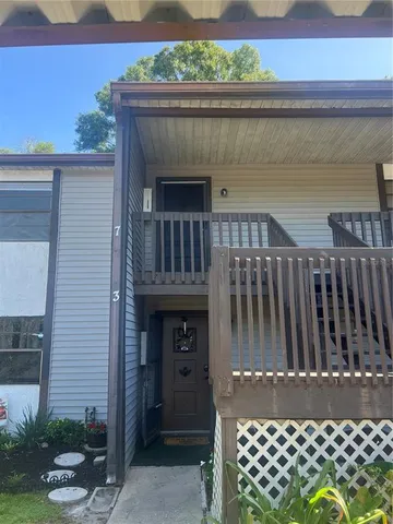 a view of a balcony with wooden floor