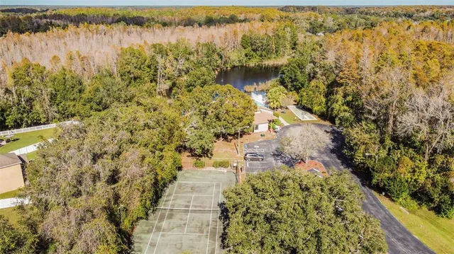 a view of residential houses with yard