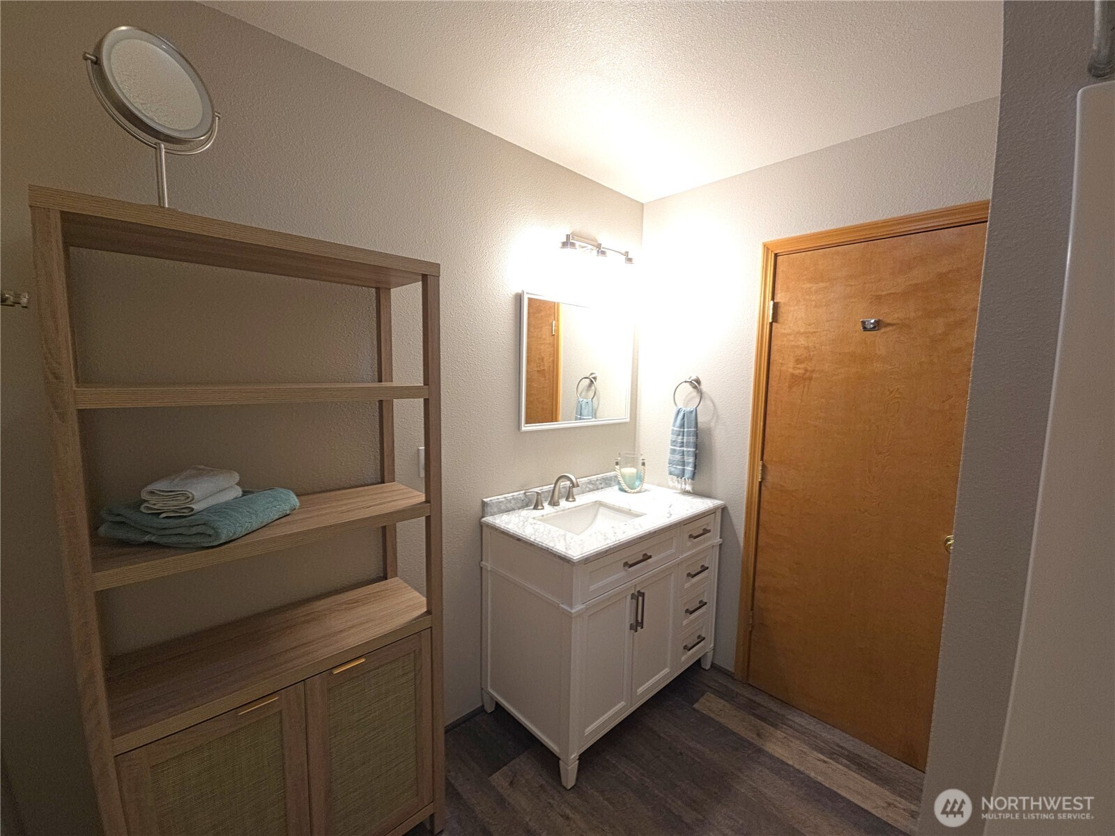 240 Stringtown Road Ilwaco, WA 98624 - Photo 17 of 39 a bathroom with a sink a toilet and mirror