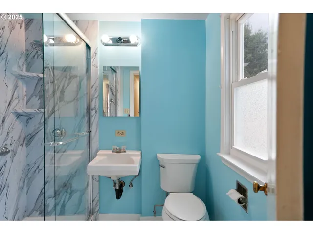 a bathroom with a bathtub and shower