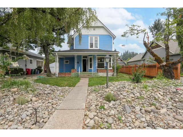 front view of a house with a yard
