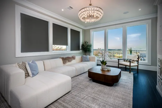 a living room with couches and a flat screen tv