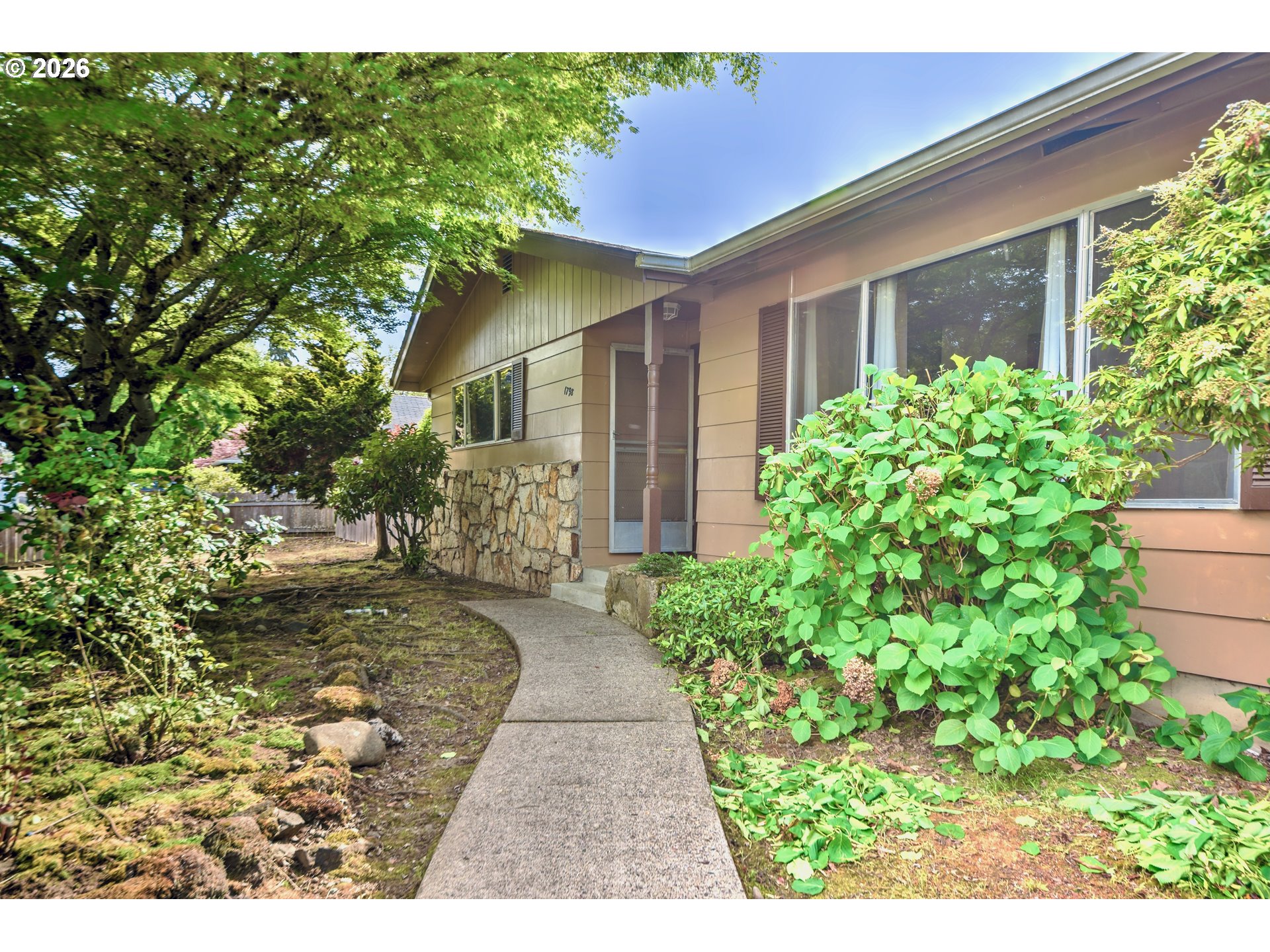 1798 Gilham Road Eugene, OR 97401 - Photo 1 of 30 a front view of a house with garden