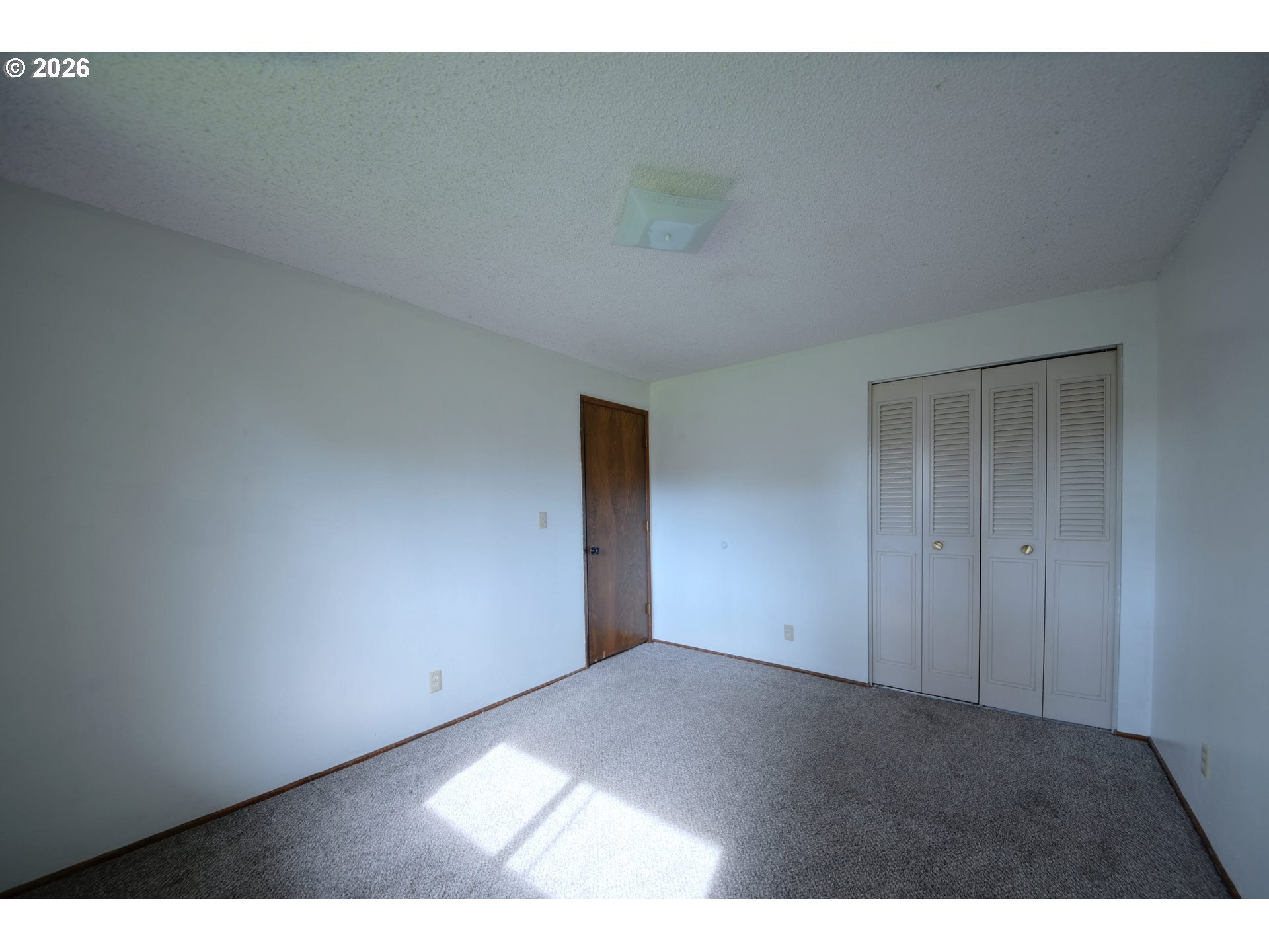 1798 Gilham Road Eugene, OR 97401 - Photo 17 of 30 a view of an empty room and window