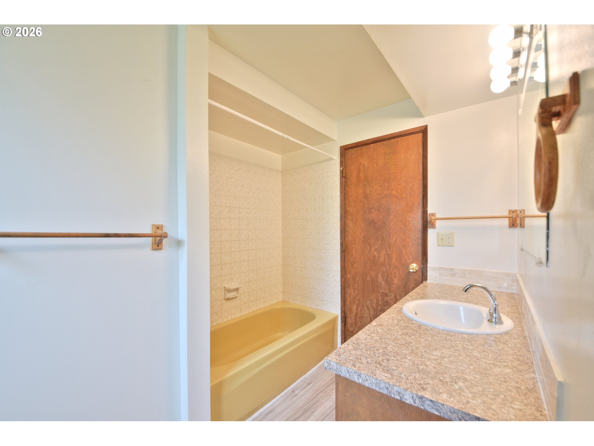 1798 Gilham Road Eugene, OR 97401 - Photo 19 of 30 a bathroom with a granite countertop sink and a mirror