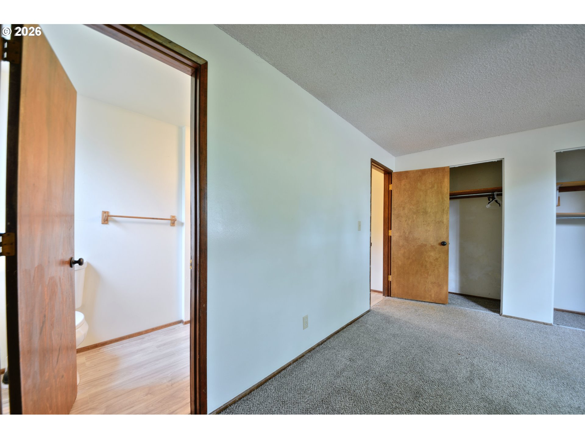 1798 Gilham Road Eugene, OR 97401 - Photo 20 of 30 a view of an empty room with wooden floor