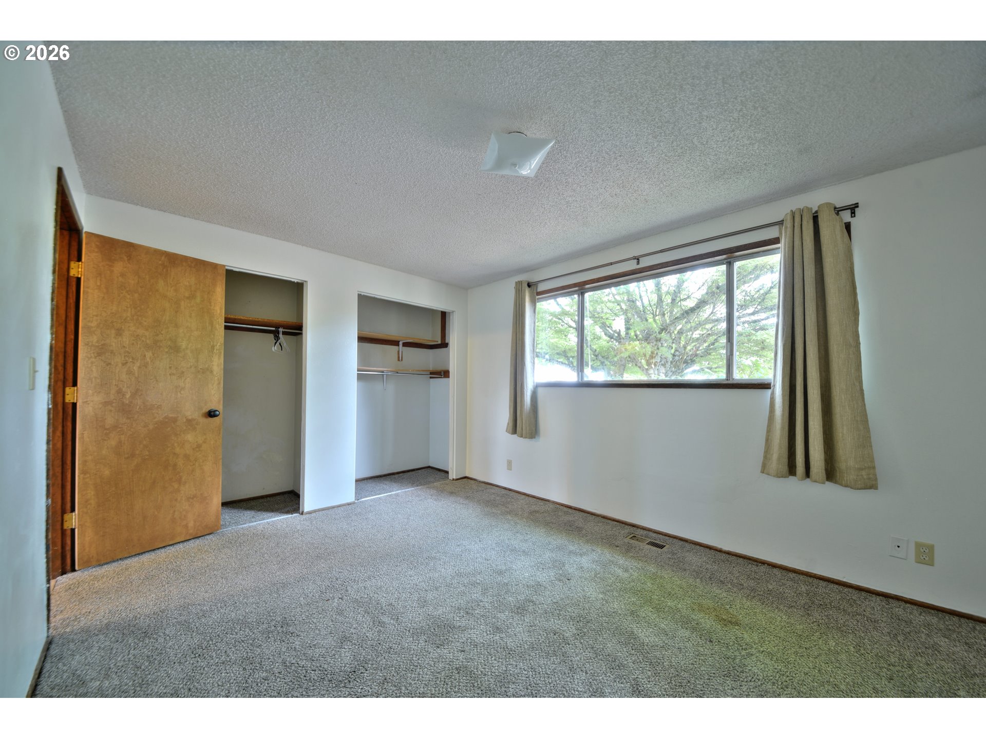 1798 Gilham Road Eugene, OR 97401 - Photo 21 of 30 a big room with windows and closet