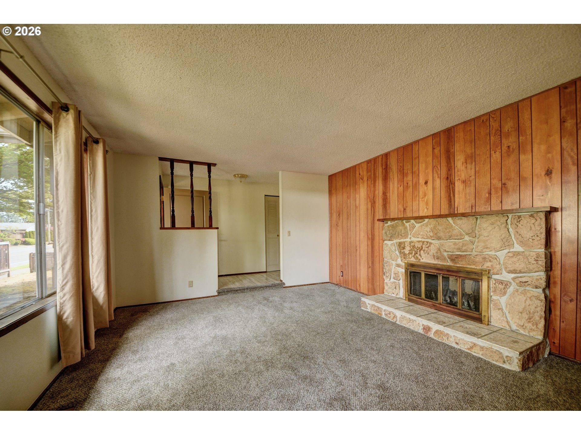 1798 Gilham Road Eugene, OR 97401 - Photo 4 of 30 a view of empty room with fireplace