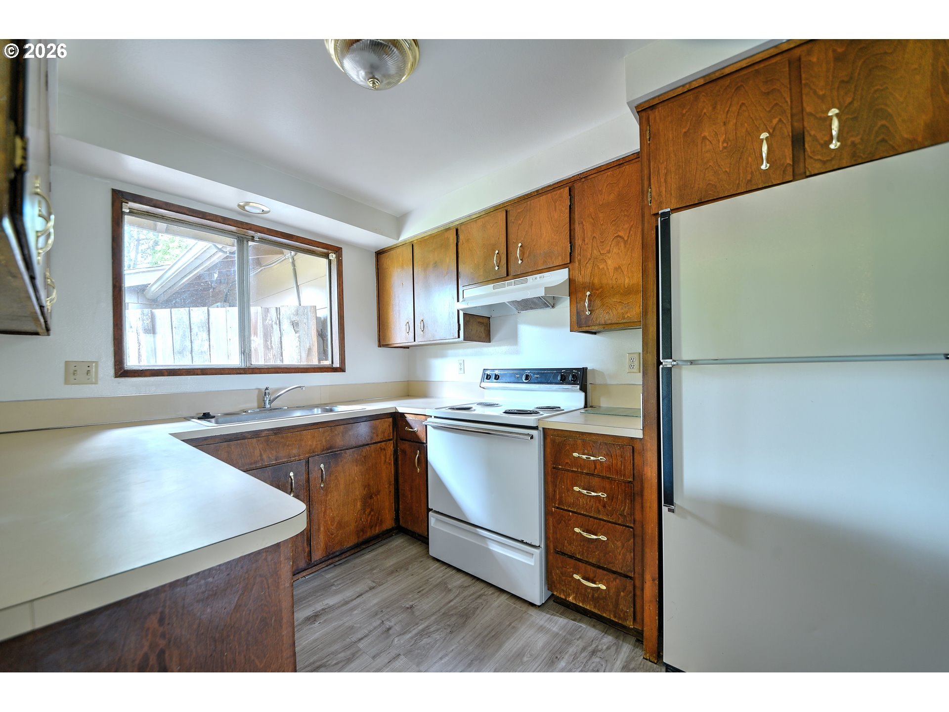 1798 Gilham Road Eugene, OR 97401 - Photo 9 of 30 a kitchen with stainless steel appliances granite countertop a sink and a stove