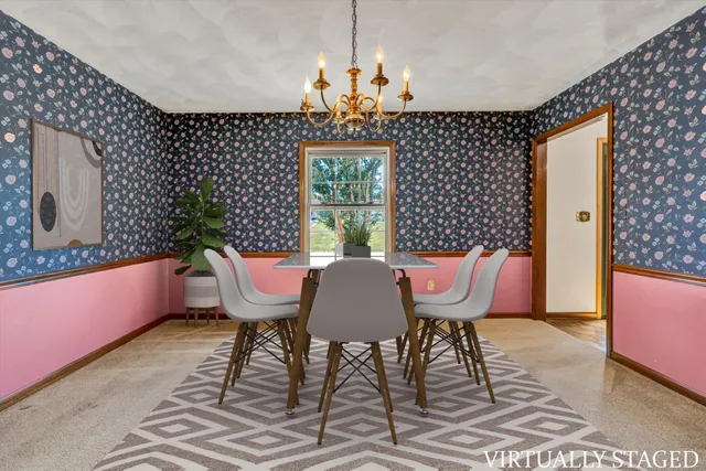 a view of a big room with wooden floor and windows