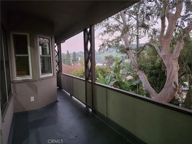 a room with a washing machine and cabinets
