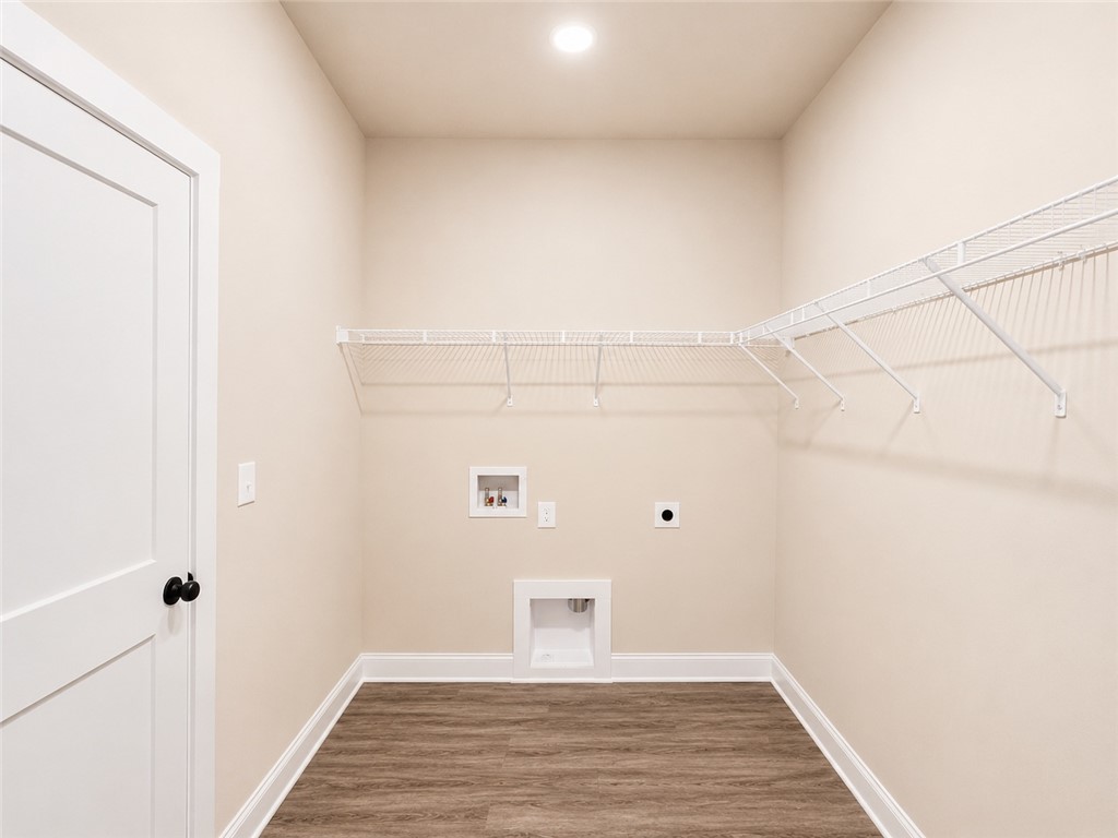 328 Point Road Westminster, SC 29693 - Photo 15 of 24 A dedicated laundry room with wire shelving offers practical utility and organized storage.