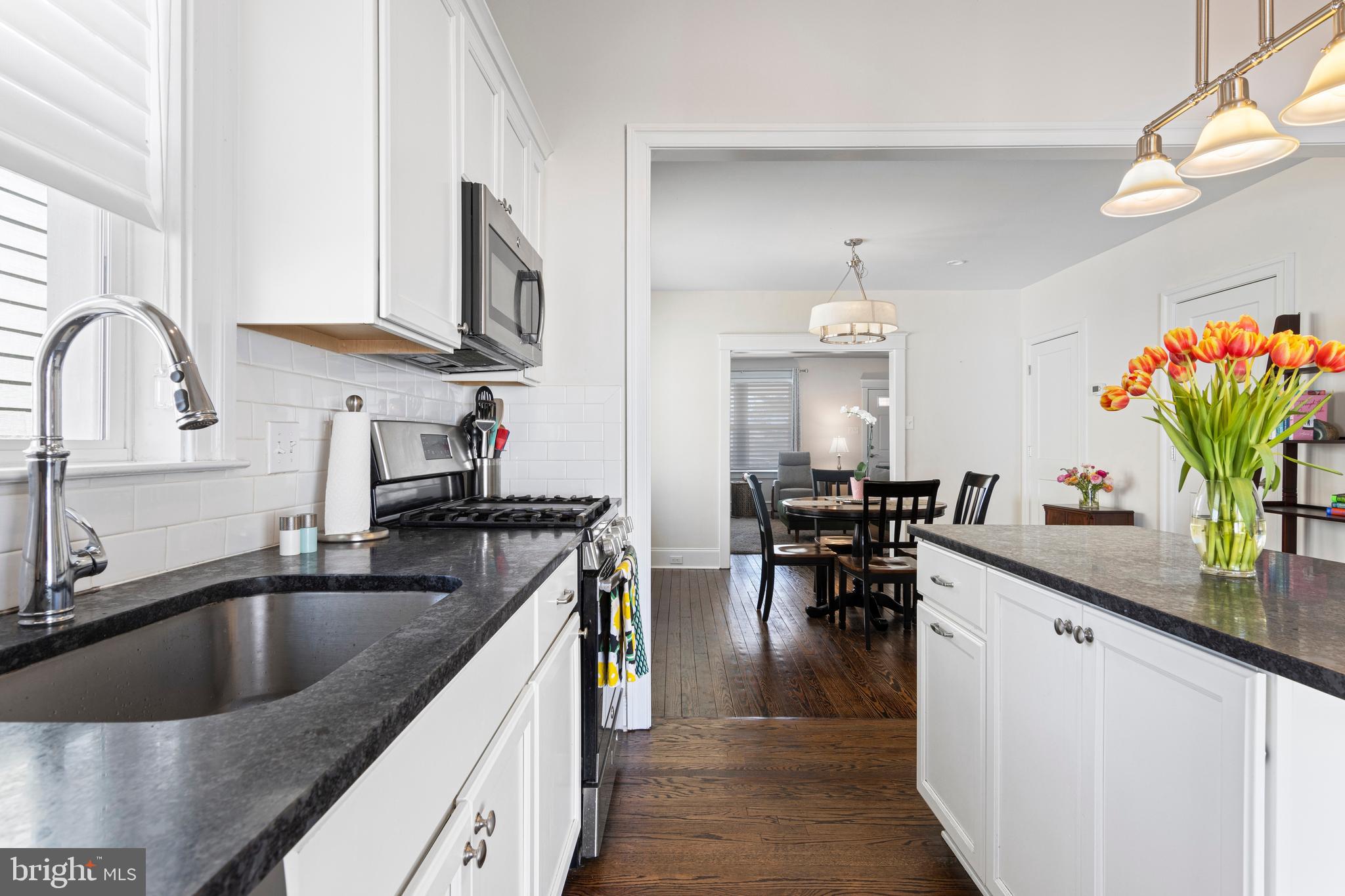 657 West End Walk Media, PA 19063 - Photo 12 of 26 a kitchen with stainless steel appliances granite countertop a sink stove and cabinets